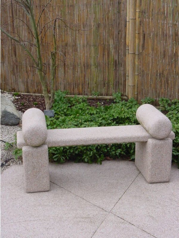 Japanese roll top stone bench with arm rests